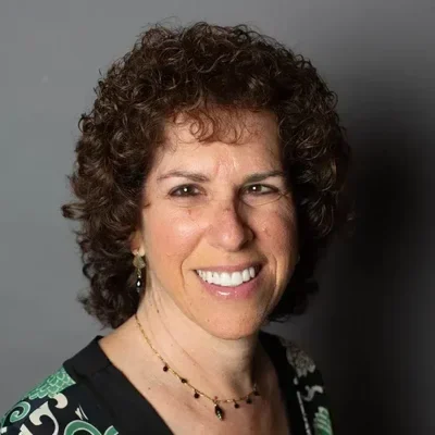 A headshot photo of Beth