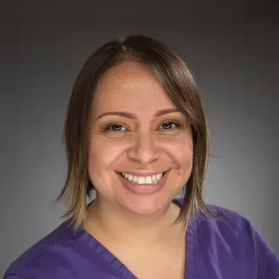 A headshot photo of Maria
