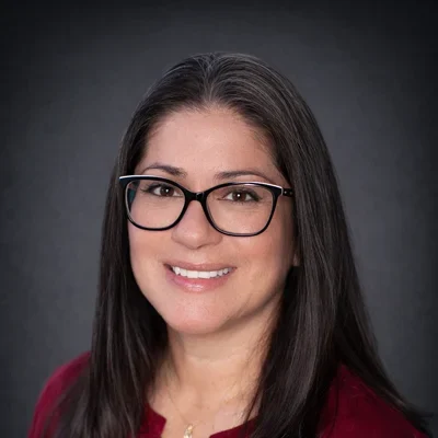 A headshot photo of Sara